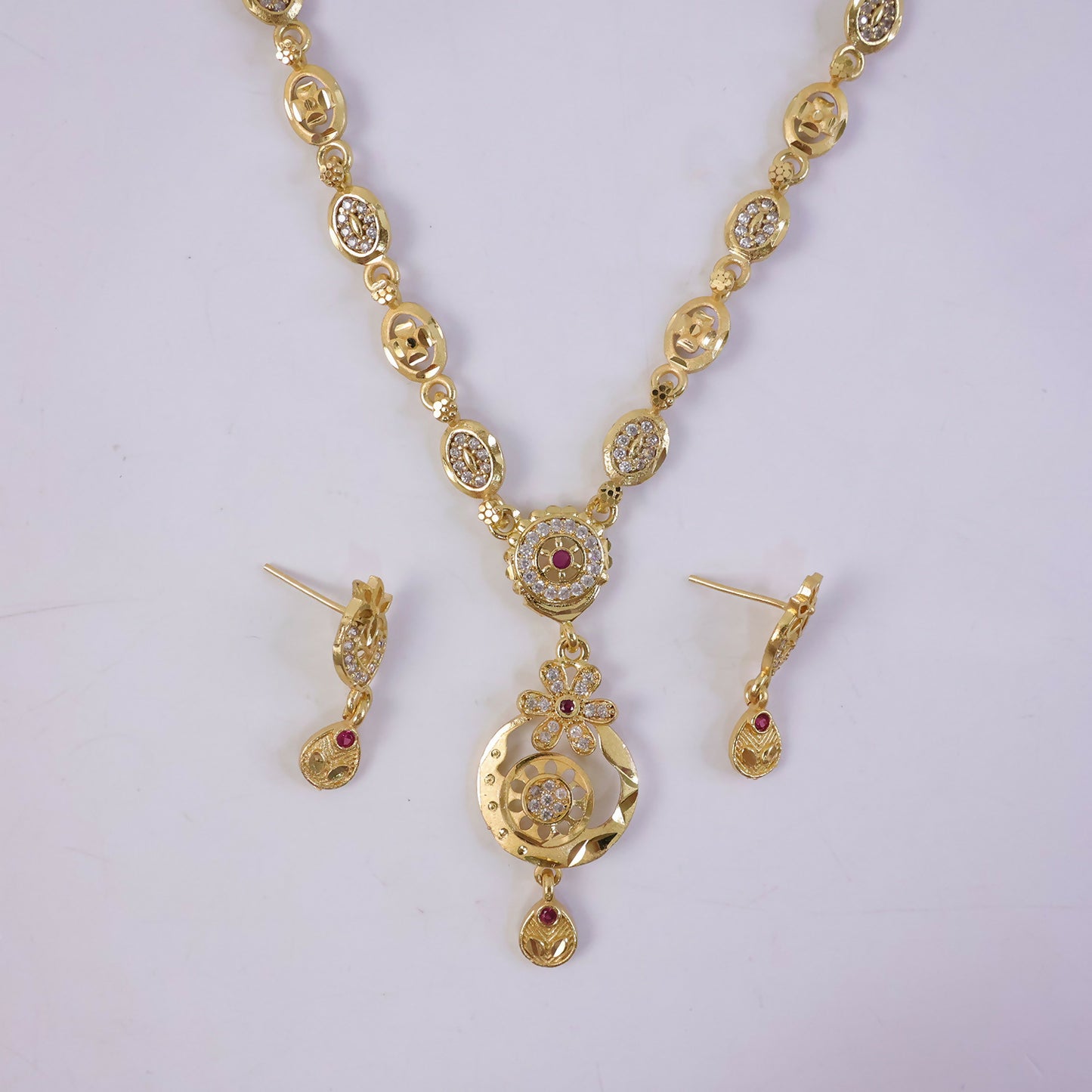Stylish Gold-Tone Circular Pendant Necklace Set with Floral Accent & Matching Earrings