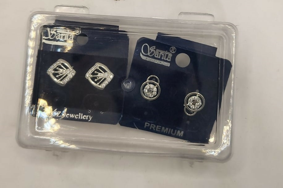 Silver cubic zirconia stud earrings set displayed in elegant jewelry box