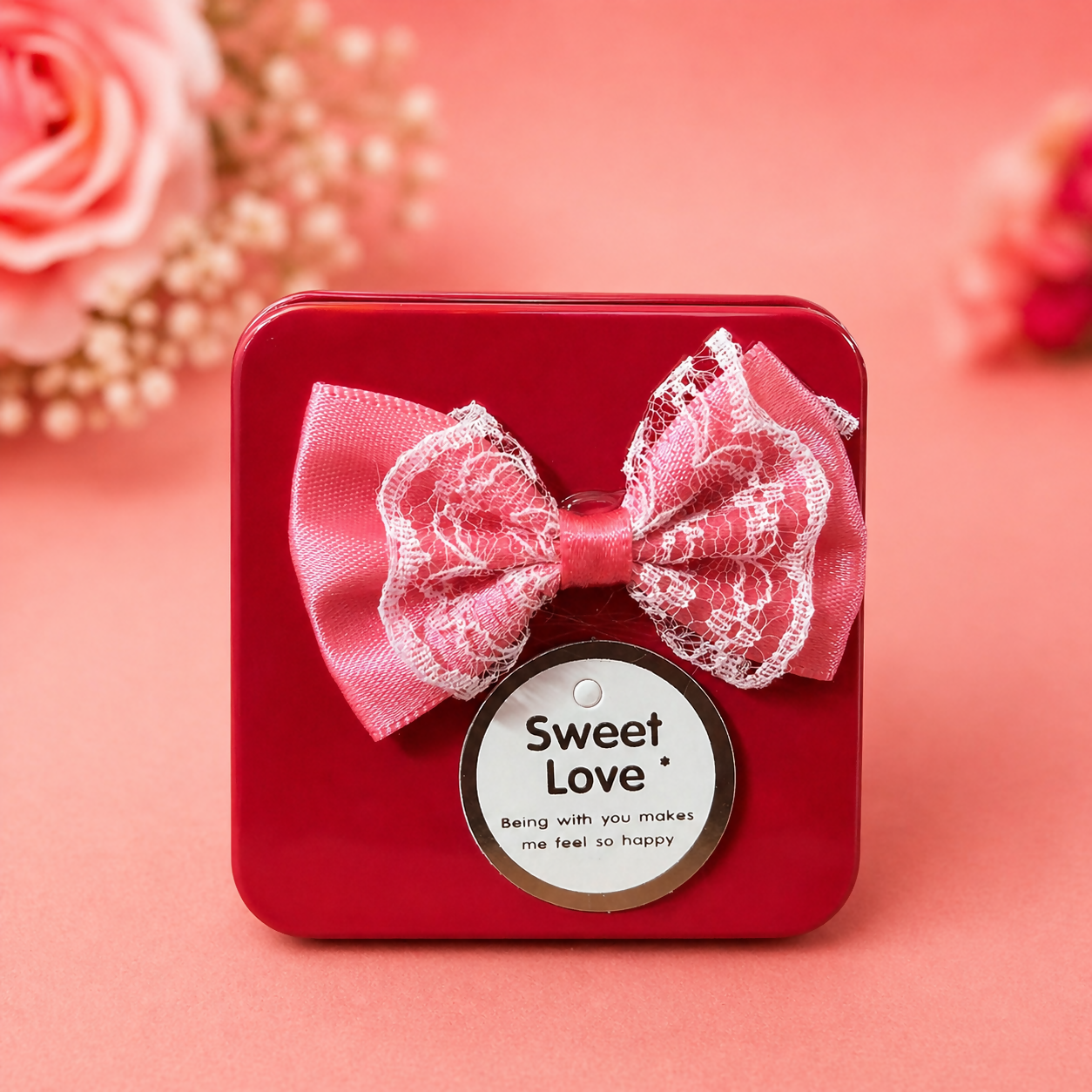 Glossy metal mini gift box with decorative bow and tag