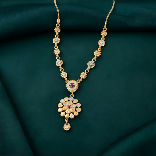 Front view of elegant gold-tone floral pendant necklace set with designer chain detailing