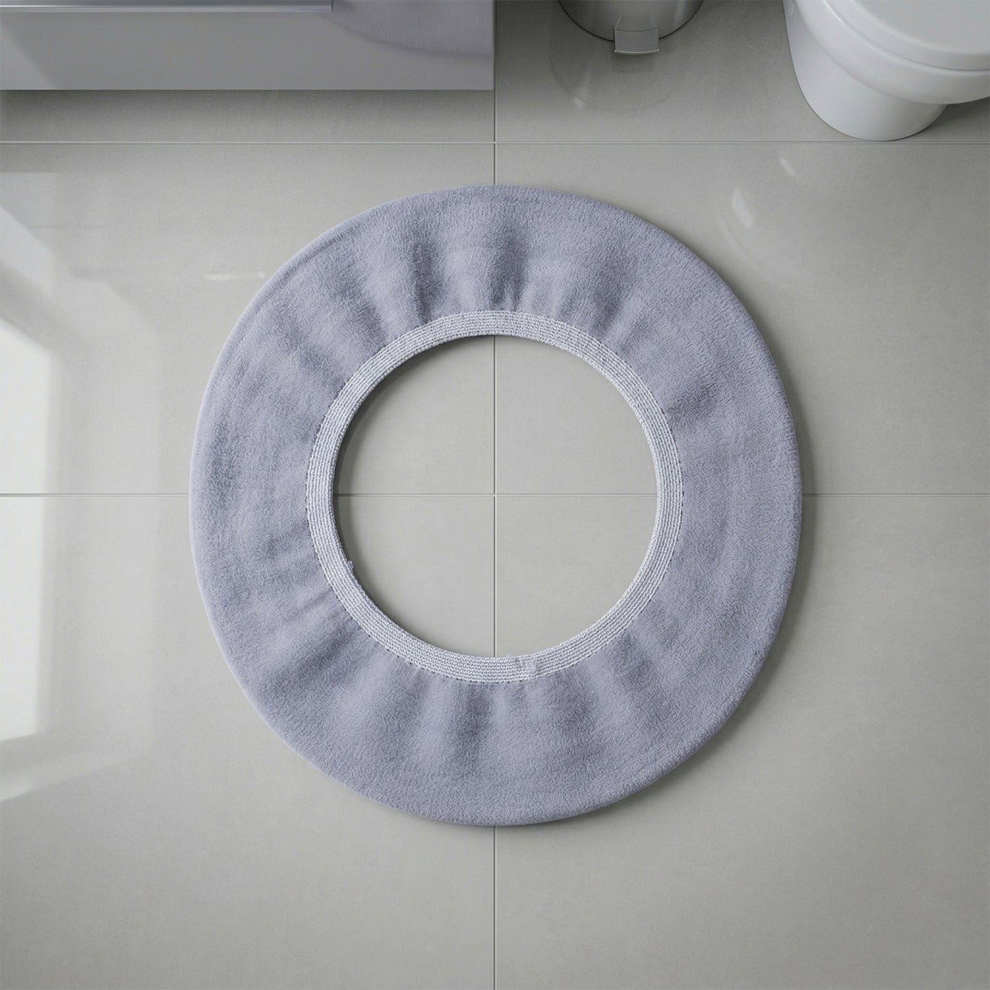 Stretchable toilet seat cover shown separately