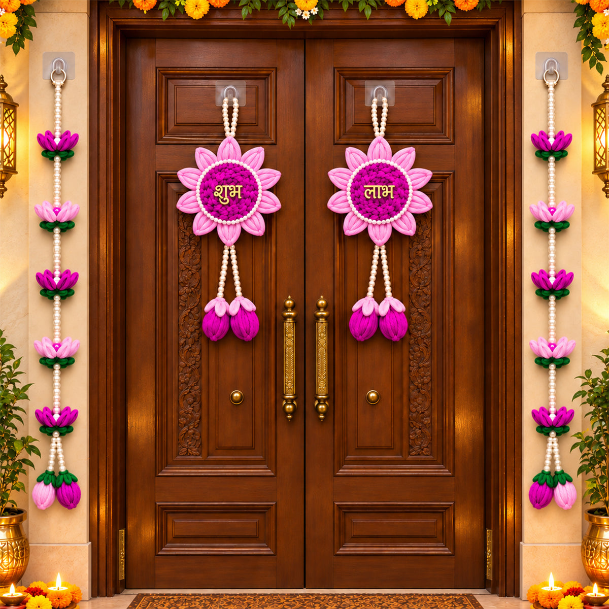 Two pink and purple lotus flower hangings with pearl beads on a brown wooden door, surrounded by marigold garlands.