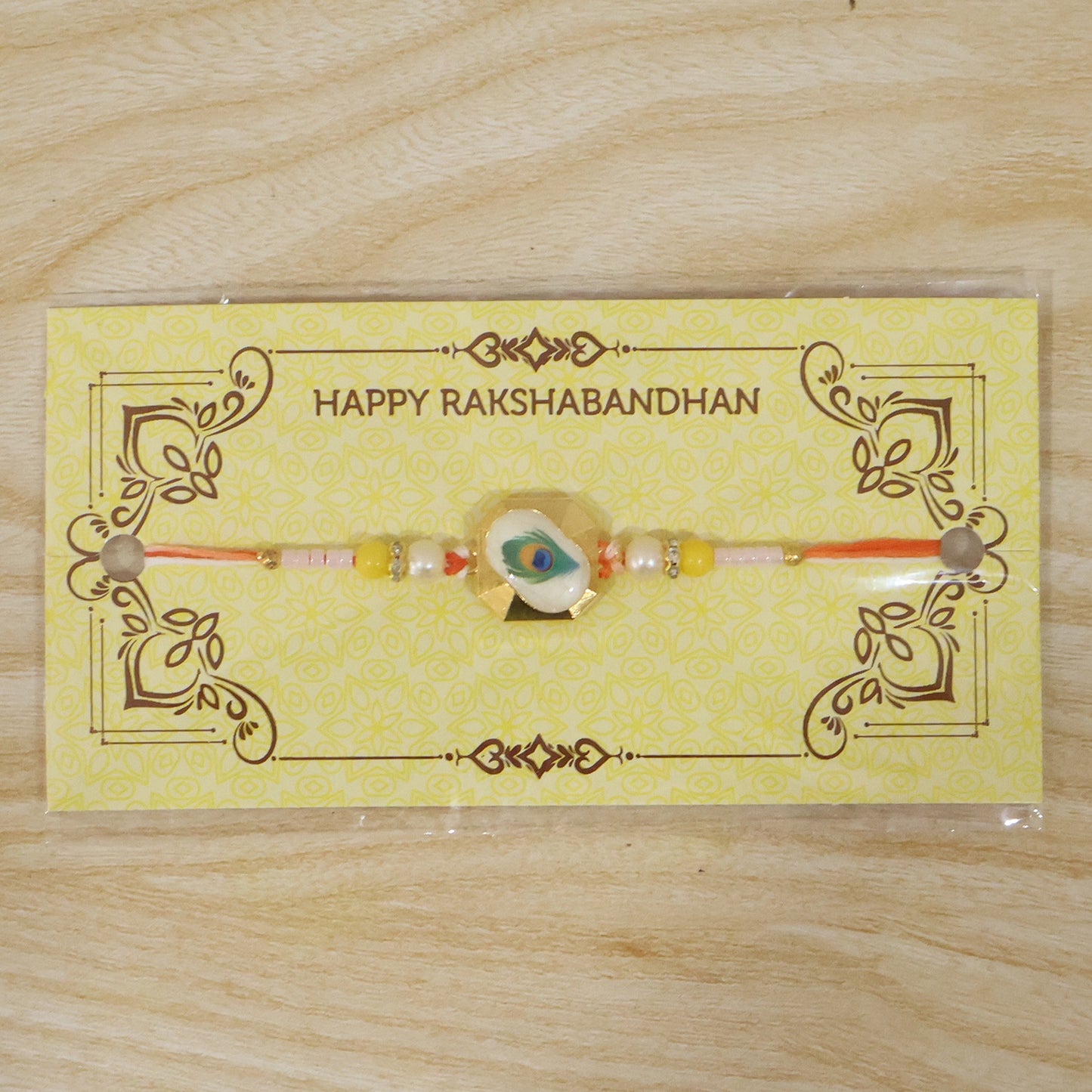 Peacock Feather Rakhi tied on wrist for celebration