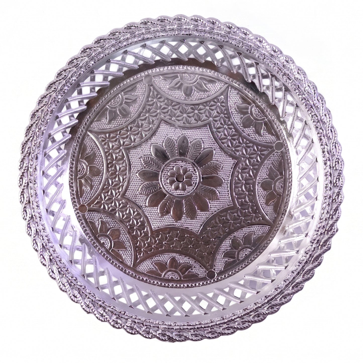 Round silver serving tray with intricate embossing and lattice border