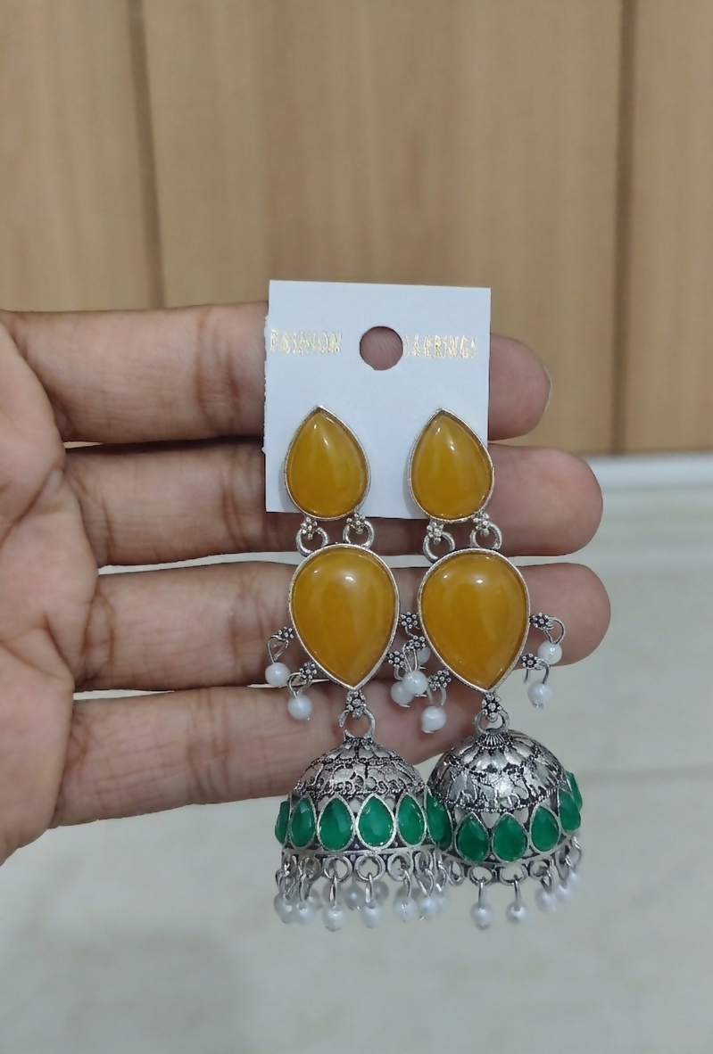 Ethnic oxidized silver jhumka earrings with yellow teardrop cabochons and pearl drops