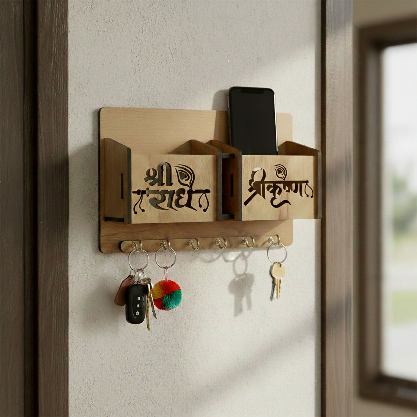 Close-up of engraved decorative lettering on wooden key holder