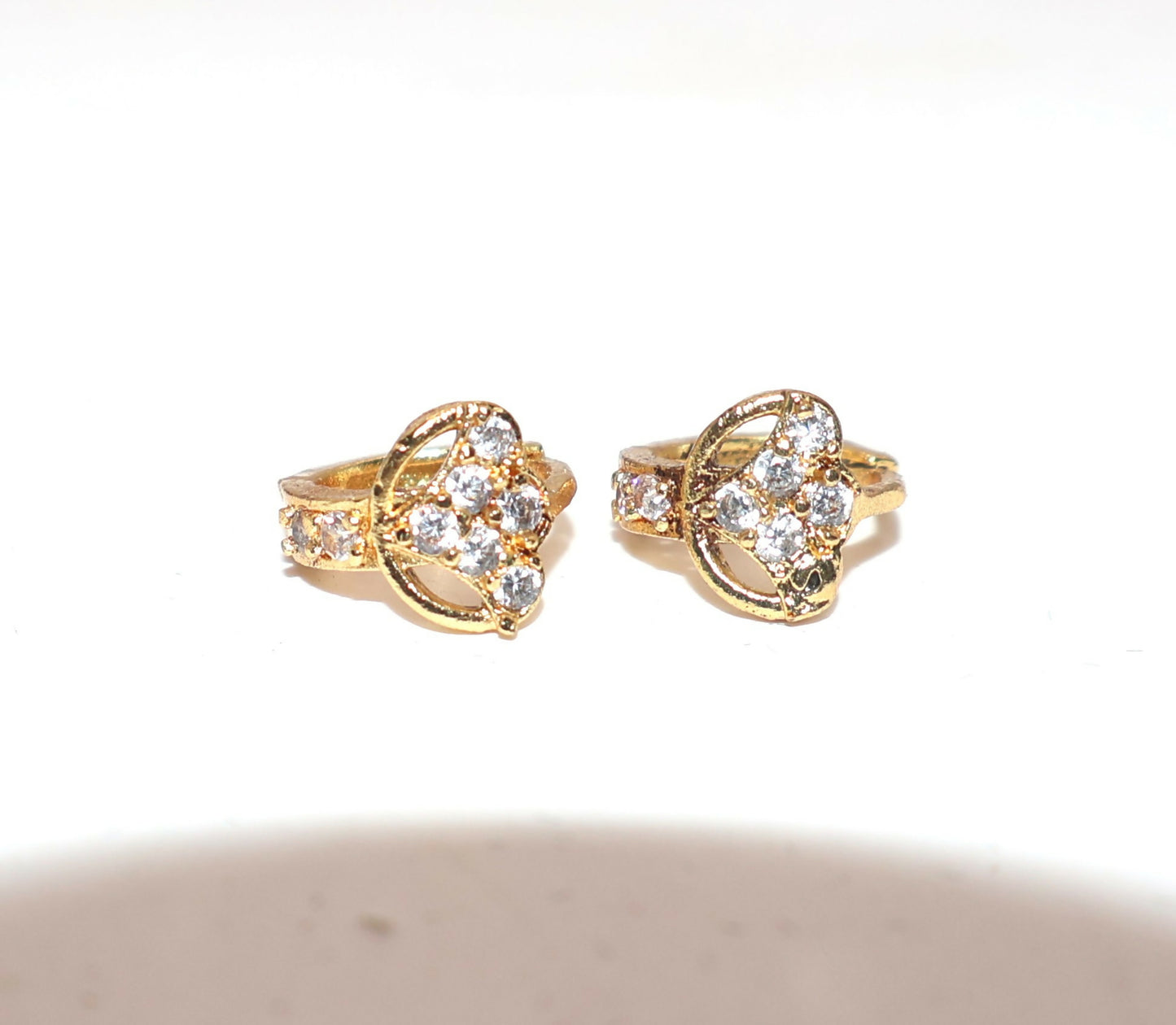 Gold plated huggie hoop earrings with dangle featuring cubic zirconia stone