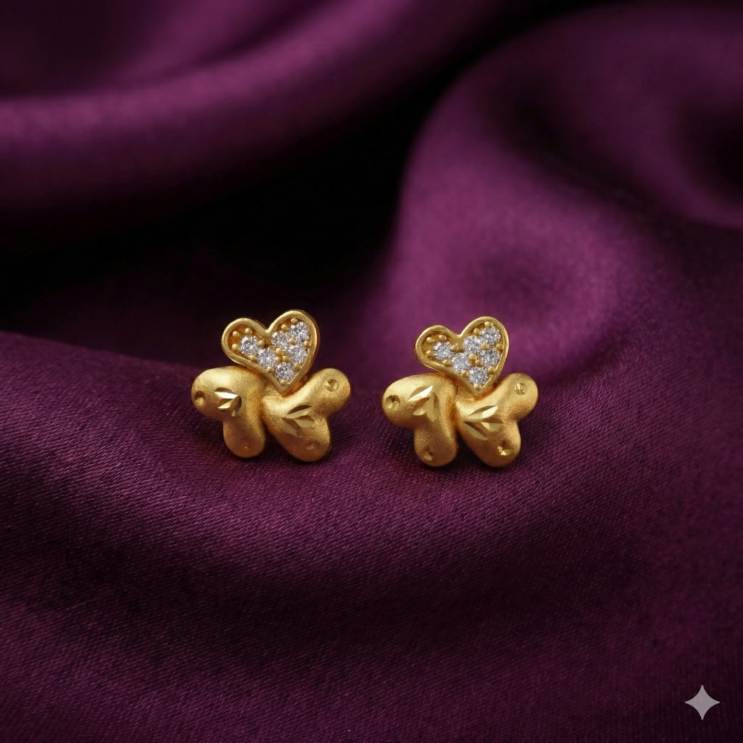 Gold plated heart and floral stud earrings with crystal accents