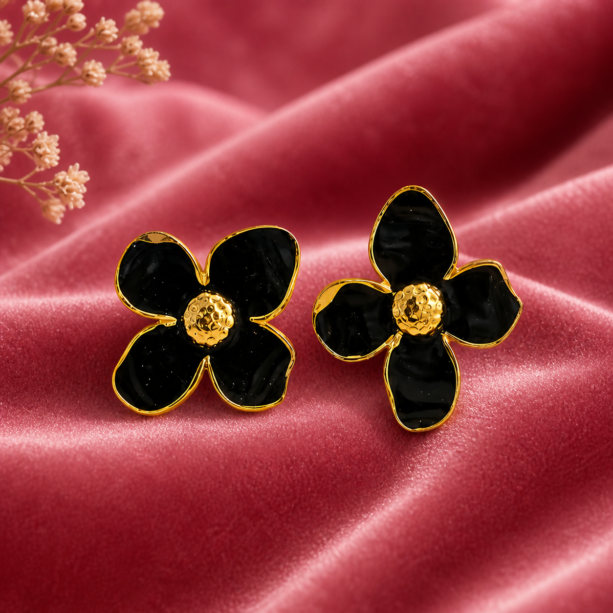 Black floral enamel stud earrings front view
