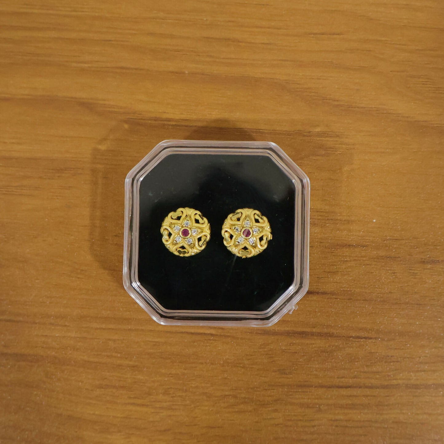 Elegant gold floral stud earrings suitable for traditional Indian outfits