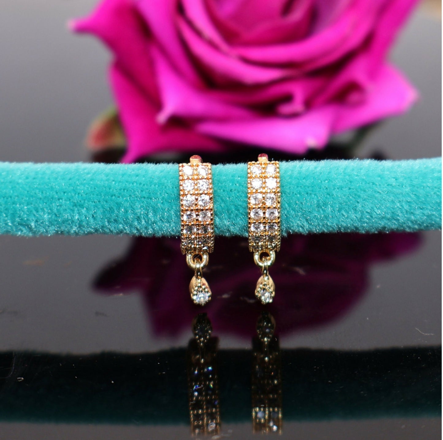 Rose gold stud earrings set showing butterfly and heart designs with sparkling Cubic Zirconia stones