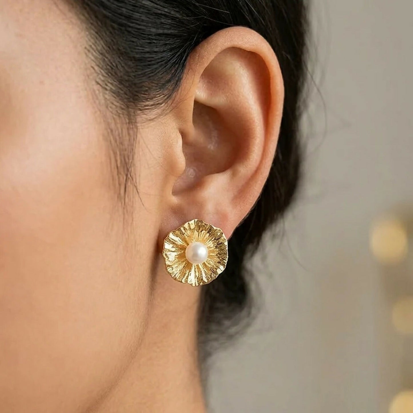 Gold-plated flower pearl stud earrings front view