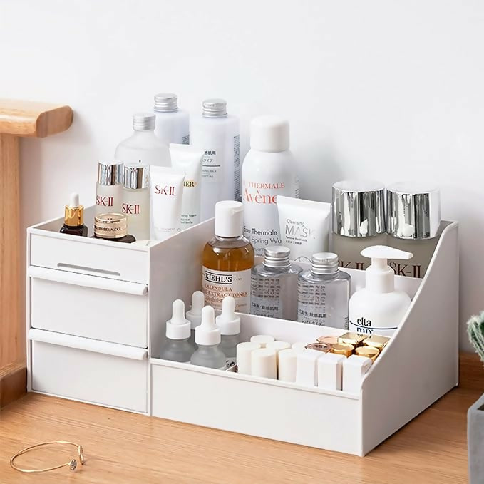White plastic makeup drawer organizer with multiple compartments and drawers