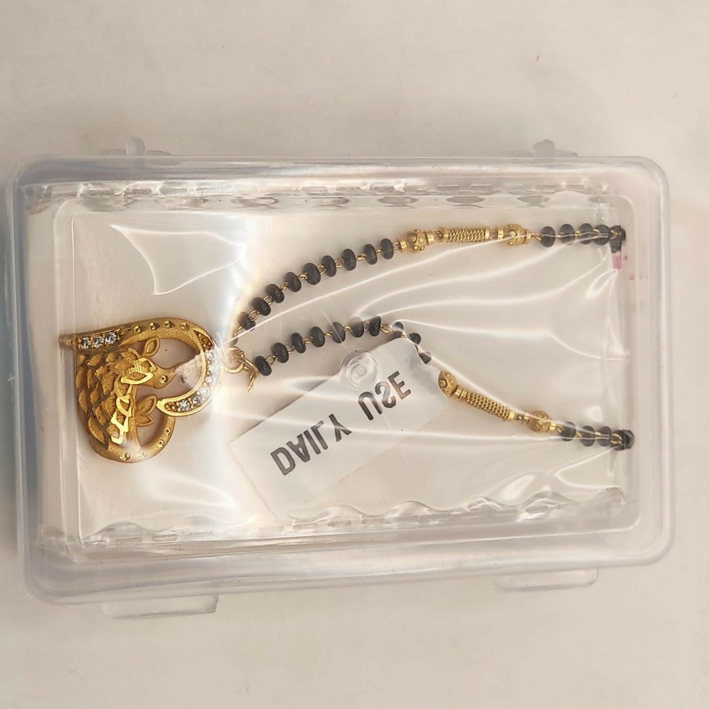 Gold-Plated AD Heart Peacock Mangal sutra with Black Beads For women