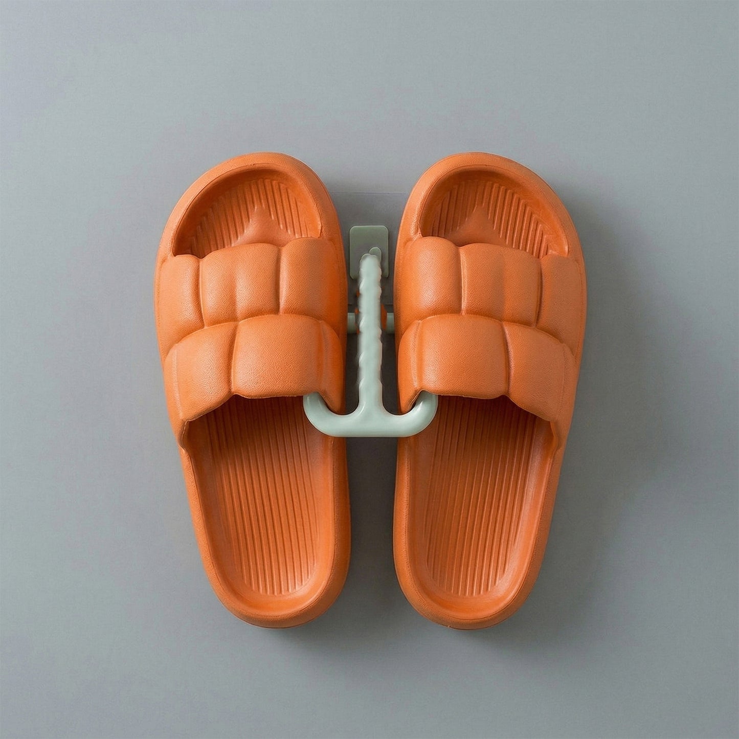 Wall mounted slipper holder in bathroom