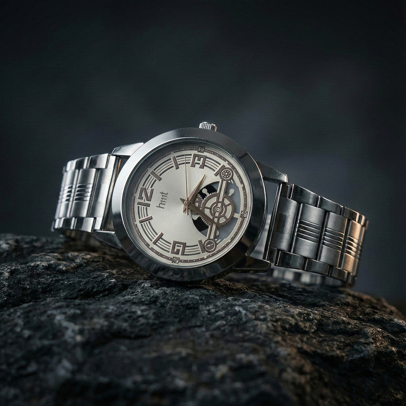 Close-up view of skeleton dial wrist watch with numeric markers and metal strap