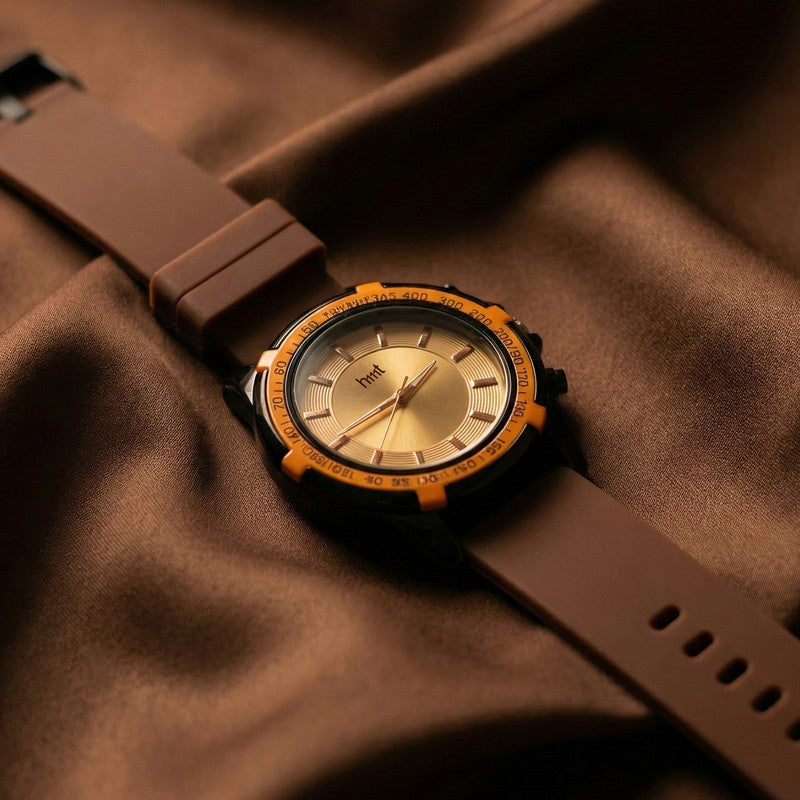 Side view of sporty analog watch with silicone strap and tachymeter bezel