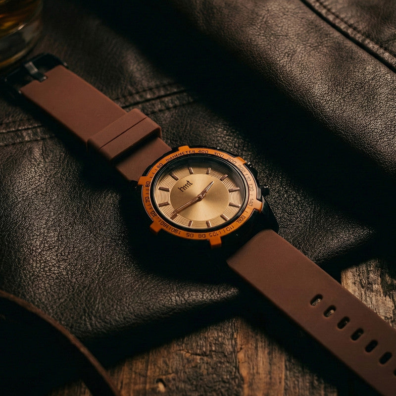 Sporty wrist watch with brown silicone strap displayed against white background