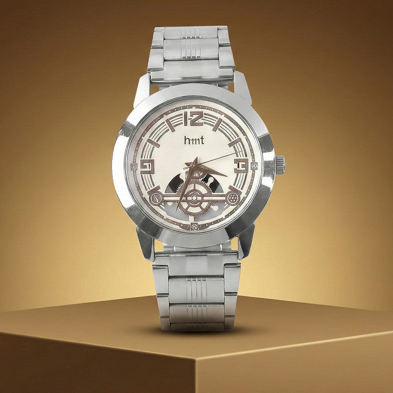 Side angle of analog wrist watch featuring skeleton dial and elegant metal strap