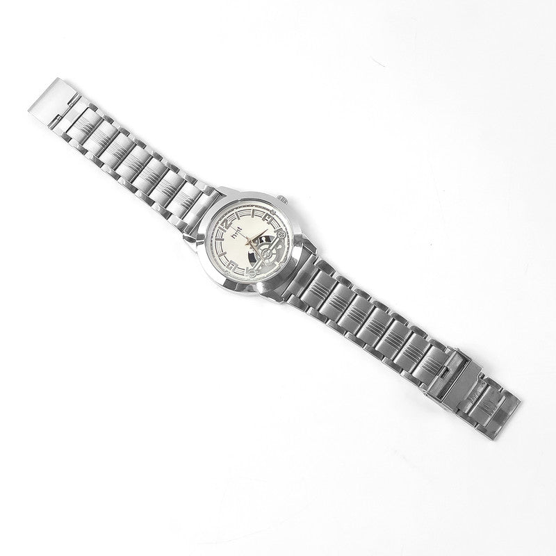 Stylish analog wrist watch showing intricate skeleton dial and metal strap