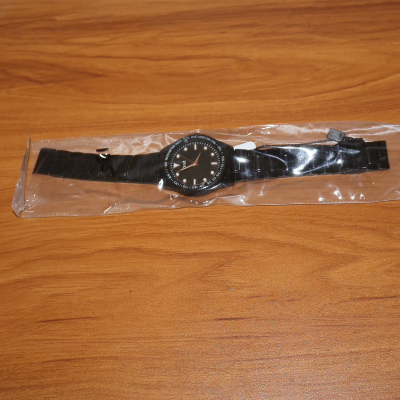 Detailed shot of tachymeter bezel and black dial on classic analog wrist watch