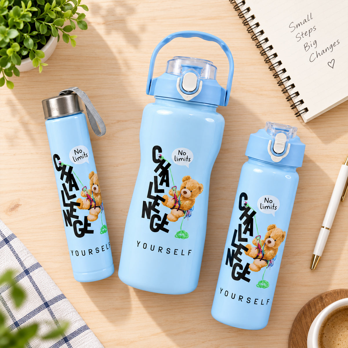 Three light blue water bottles on a wooden desk with a notebook, pen, and a cup of coffee.