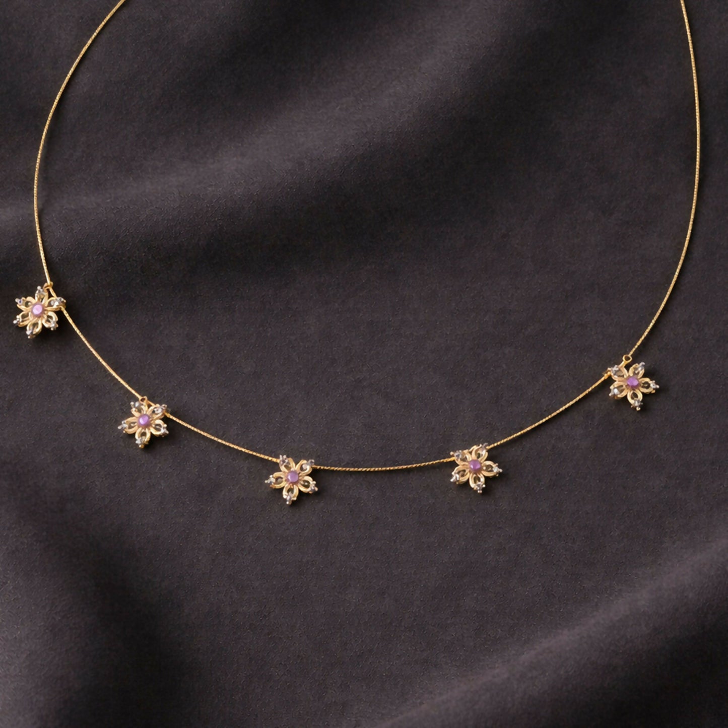 Elegant minimalist gold necklace with sparkling white stones