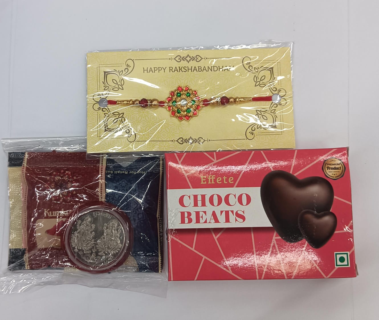 Complete Rakhi hamper with tilak pack, Rakhi, silver coin, chocolates