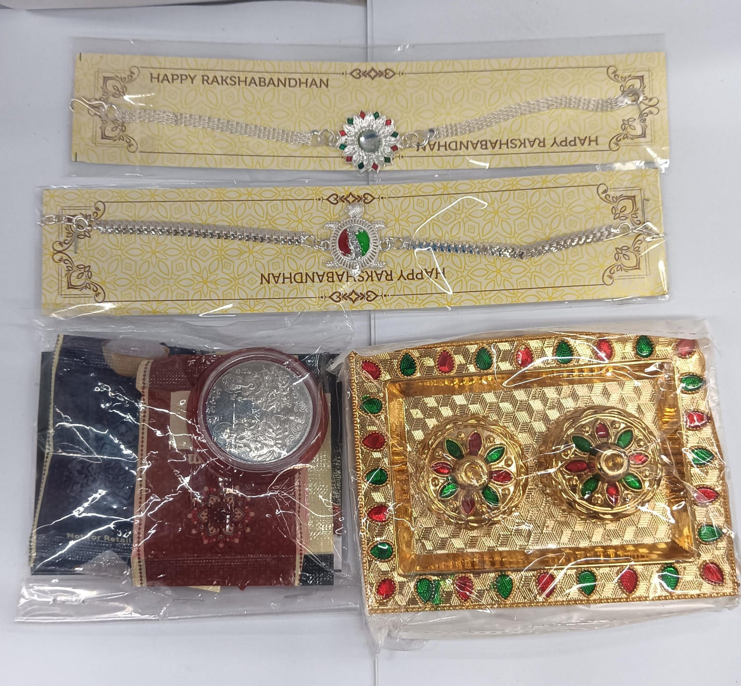Rakhi greeting card and chocolate treat in the silver rakhi set