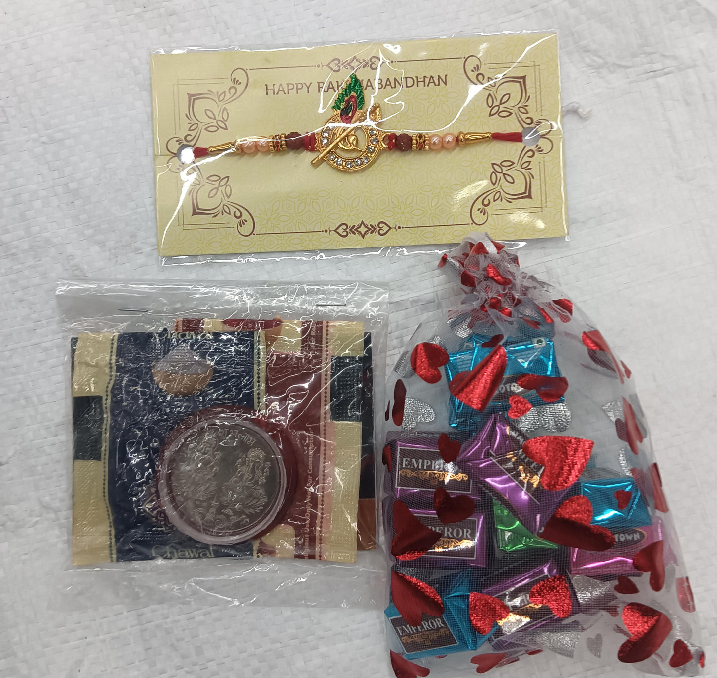 Rakhi Gift Combo with 1 Designer Rakhi for Brother โ Includes Assorted Chocolates Pouch (10 pcs), Silver Coin, Roli Chawal & Greeting Card,Rakhi Gift Combo