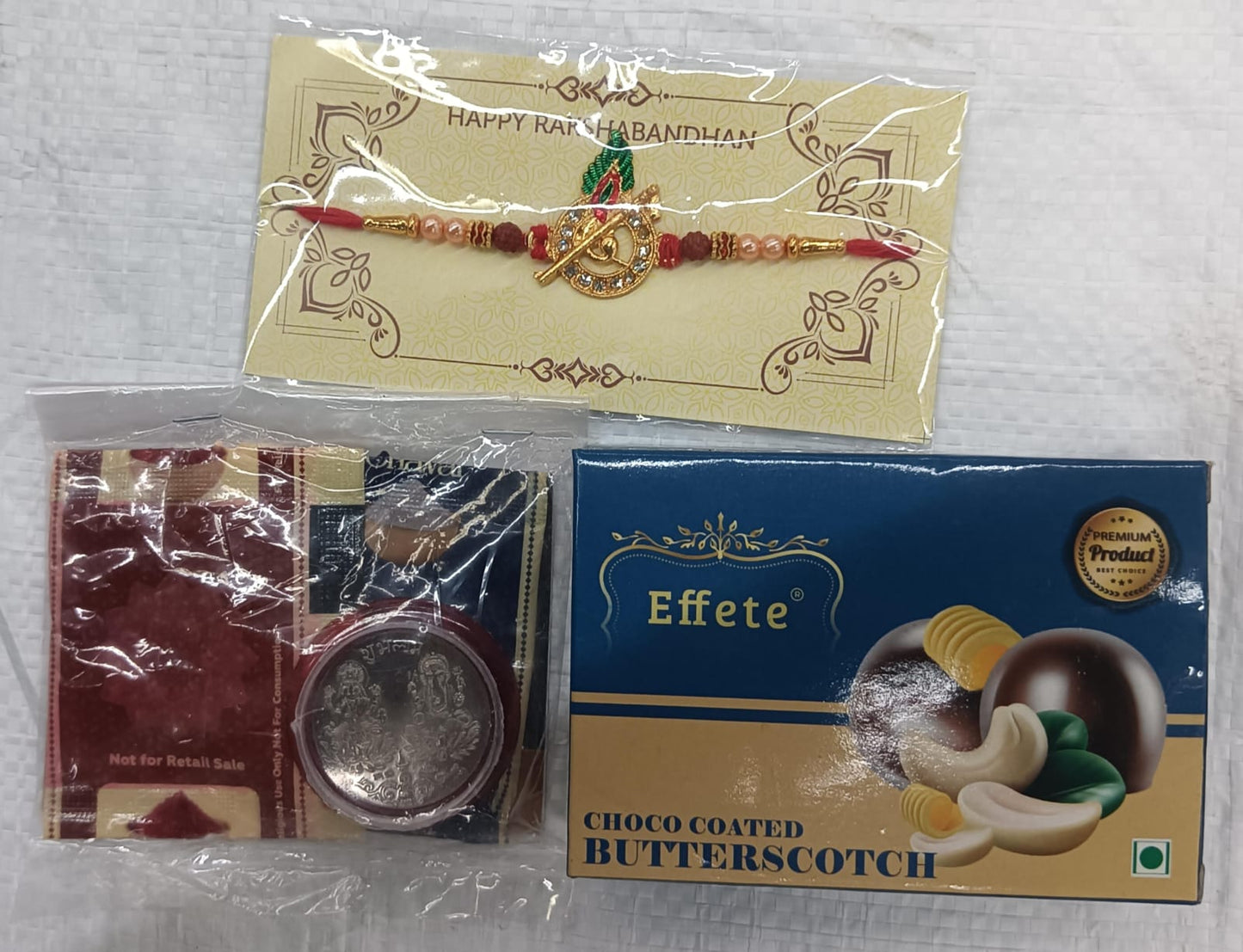 Krishna Flute Rakhi Combo Gift Set with Choco Butterscotch, Coin, Roli-Chawal & Greeting Card