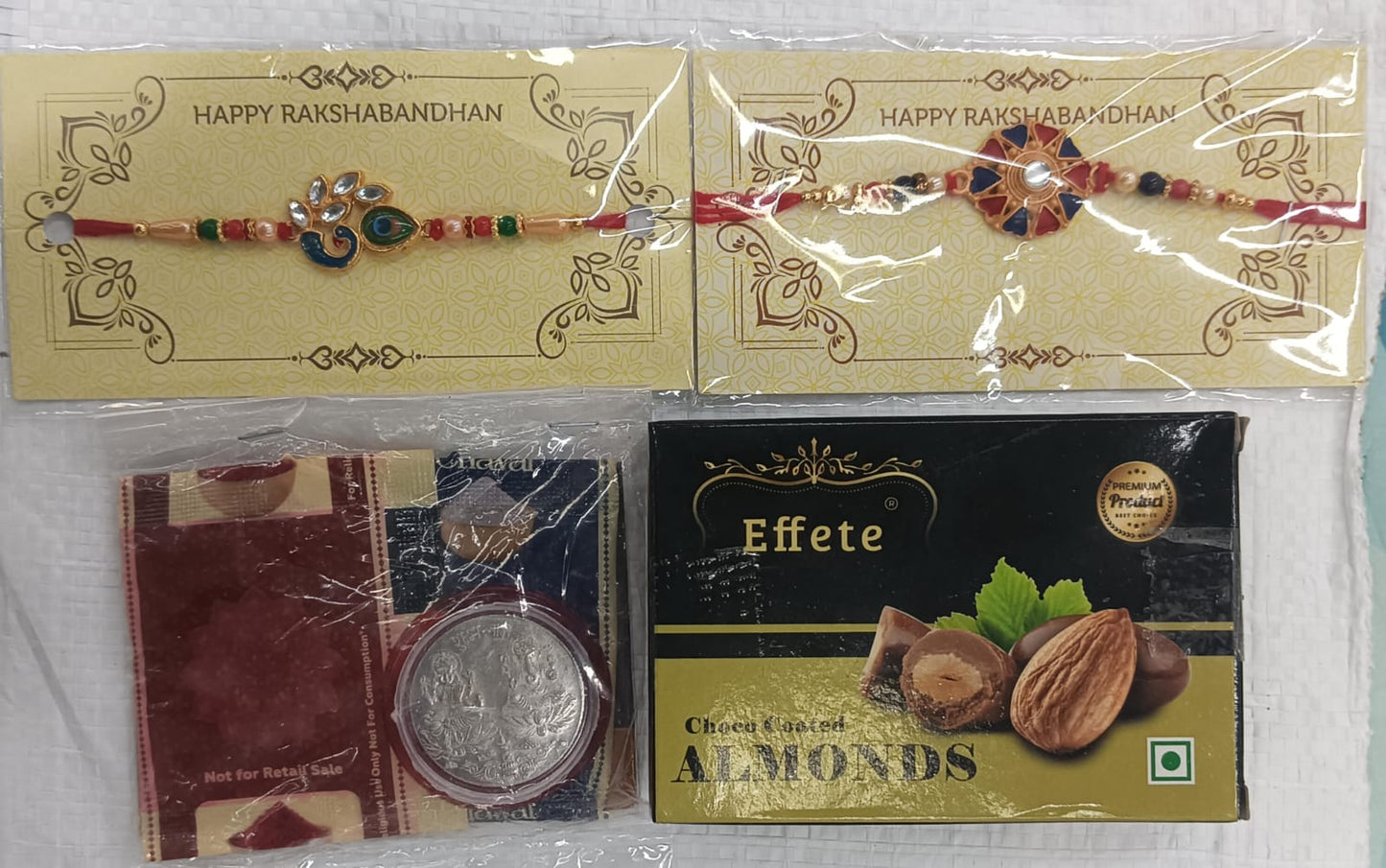 Rakhi Gift Combo with 2 Premium Rakhis for Brother – Includes Choco Coated Almonds Box, Silver Coin, Roli Chawal & Greeting Card