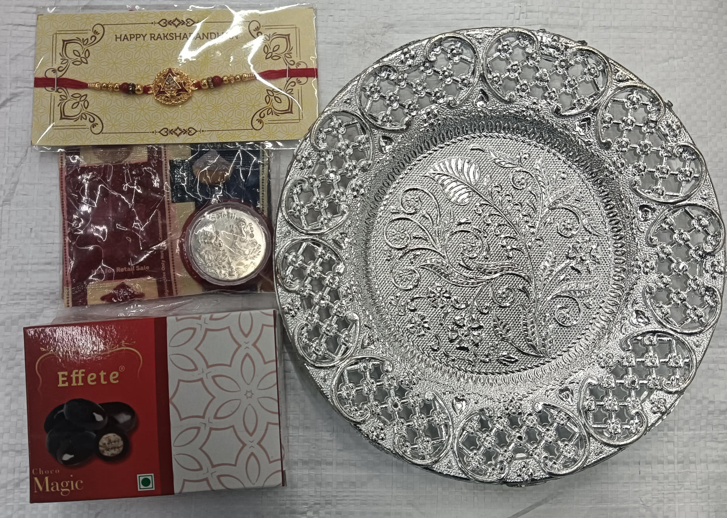 Designer Rakhi Combo Gift Set for Brother with Choco Magic, Roli Chawal, Greeting Card & Silver Coin