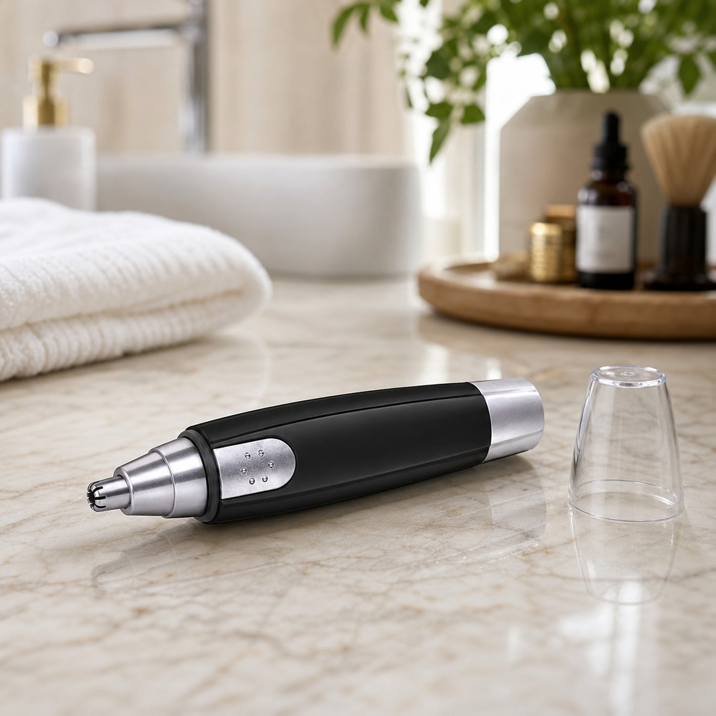 Top view of battery-operated nose hair trimmer