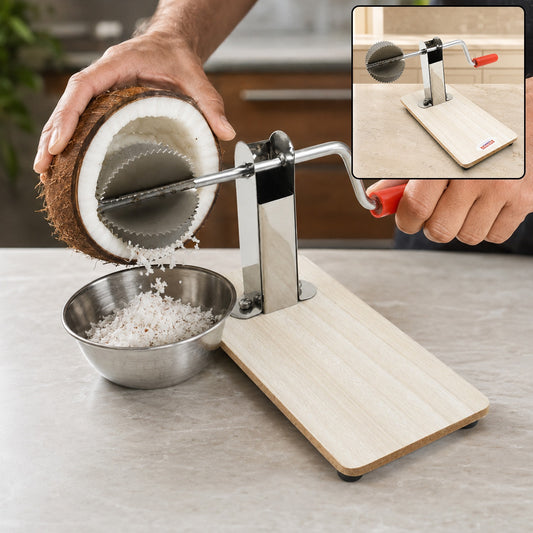 A person's hands use a stainless steel coconut scraper with a wooden base to grate a coconut into a metal bowl.