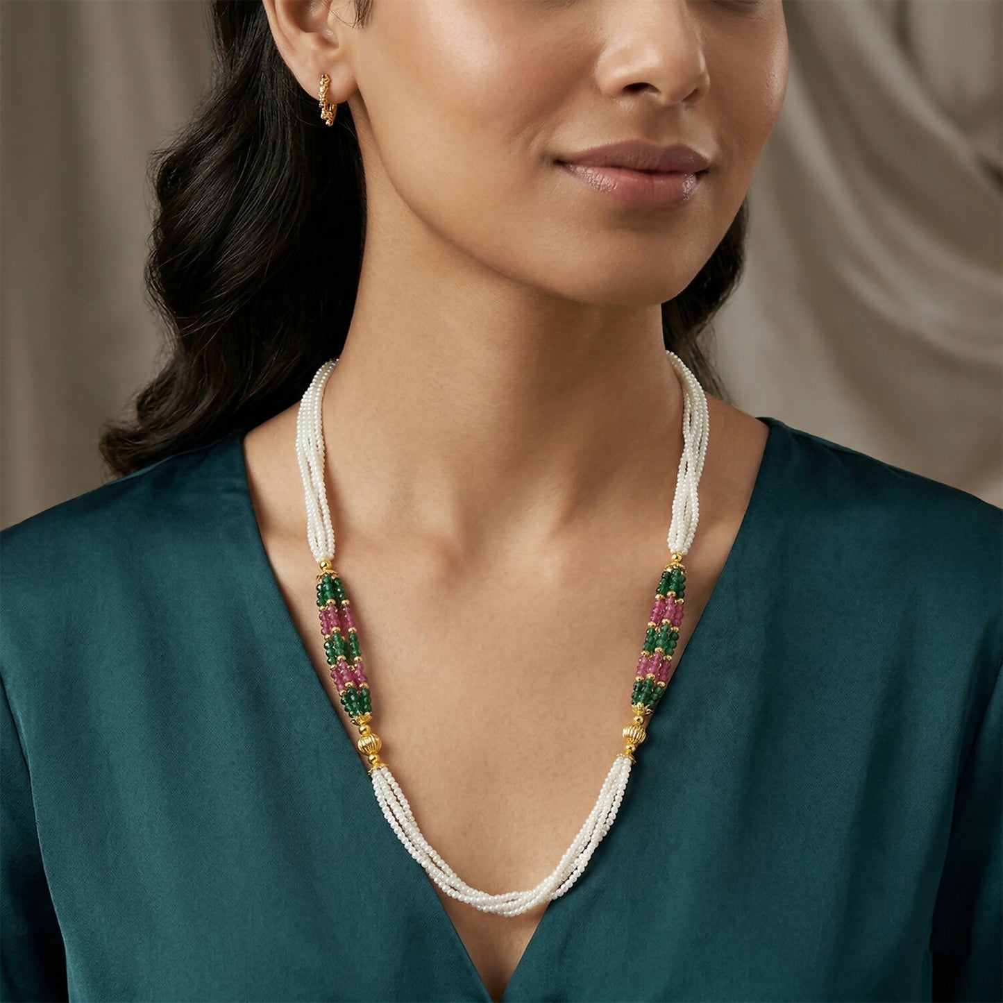 Draped white beaded mala necklace with green and pink bead accents