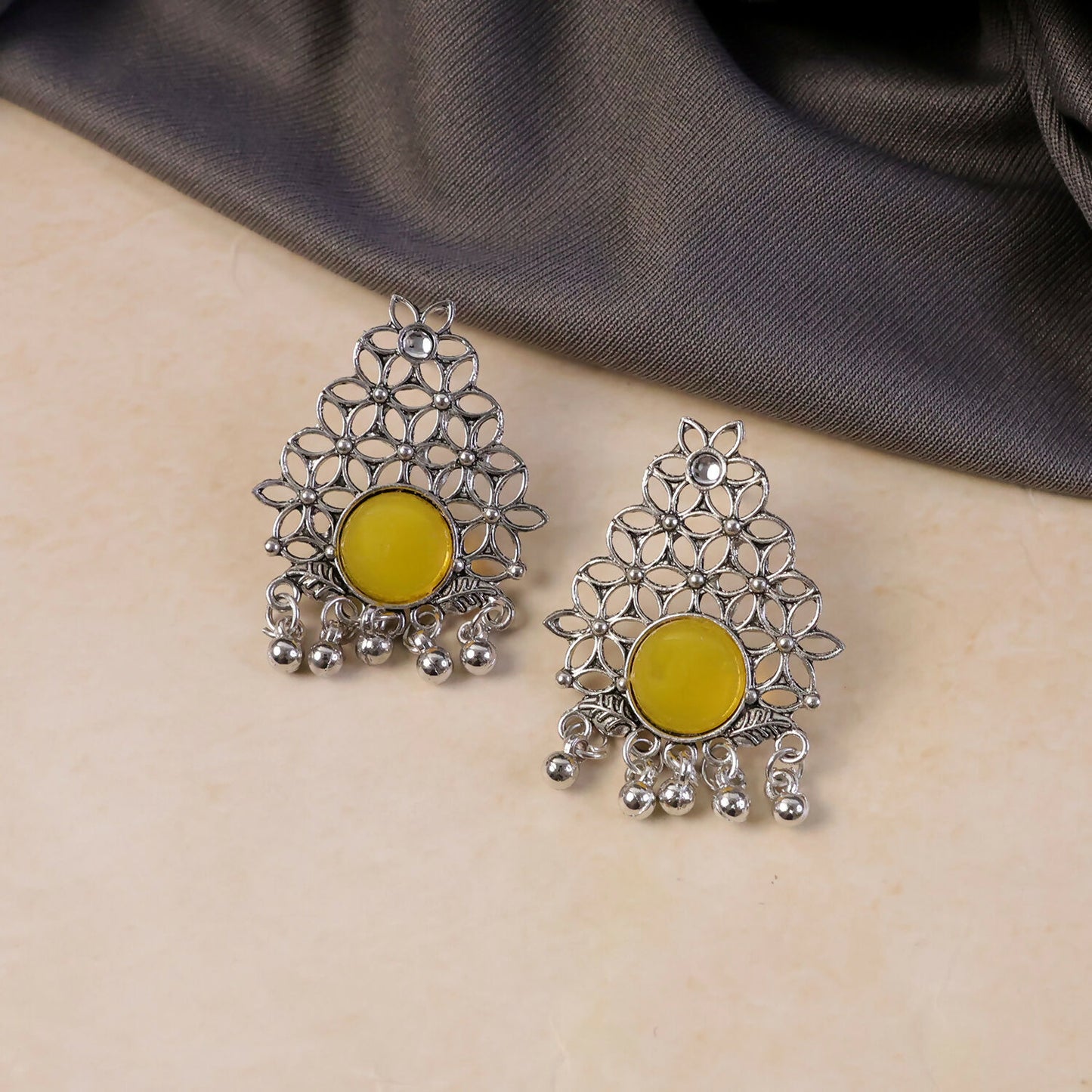 Back detail of oxidized silver earrings with ghungroo dangles