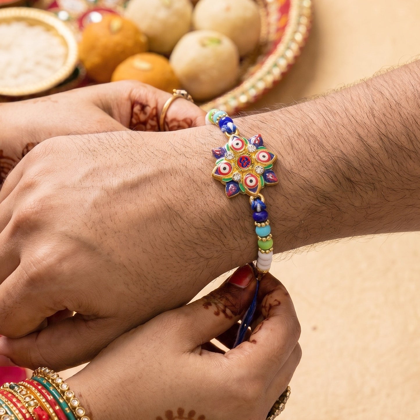 Close-up of Multi Evil Eye OM Star Designer Rakhi centerpiece