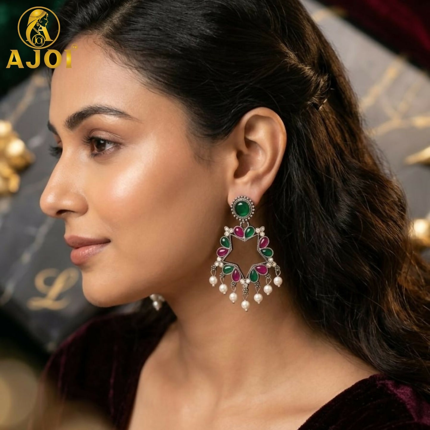 Close-up of Kundan and Pearl Drop Earrings with green and pink stones