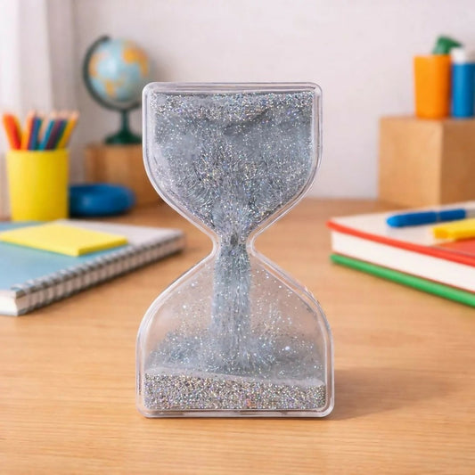 Silver glitter liquid hourglass timer on desk
