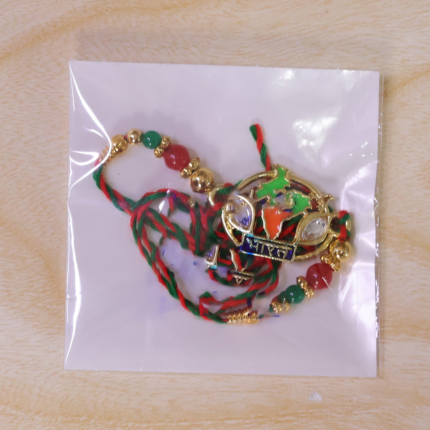 Bharat Map Pendant Rakhi with Kundan Stones and Red Beads