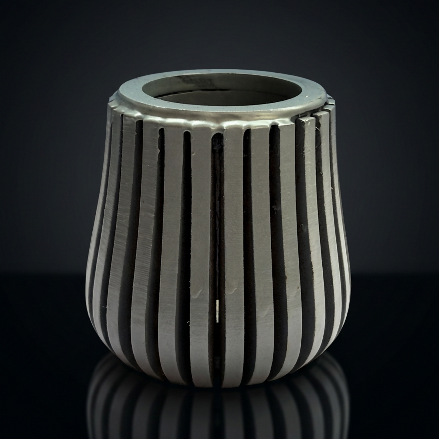 Elegant grey pen stand enhancing a tidy office workspace.