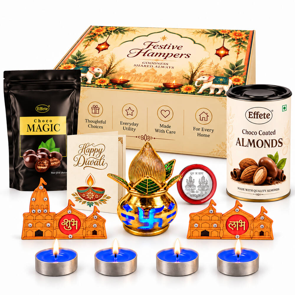 A Diwali gift set with chocolates, almonds, a greeting card, a gold kalash, shubh-labh decor, and four blue tea lights.