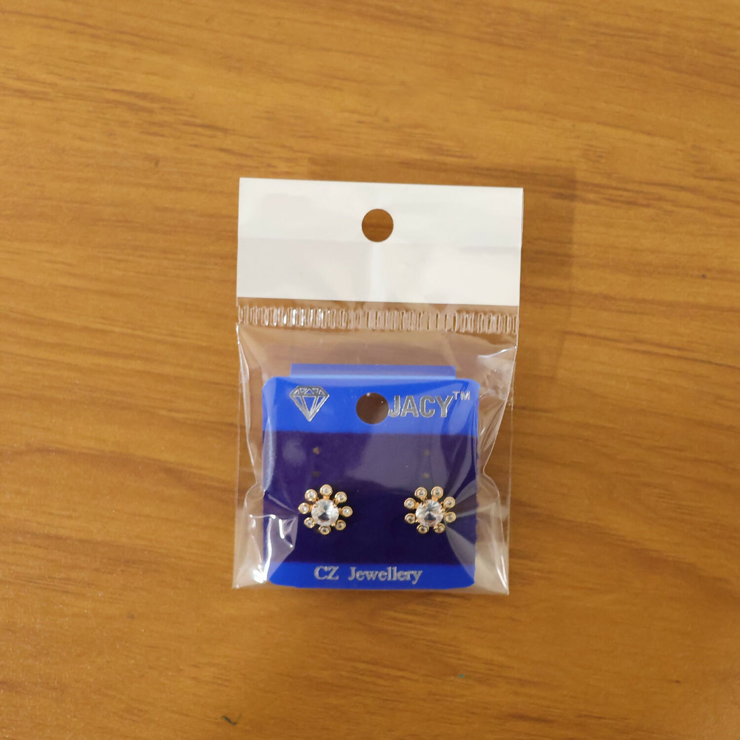Pair of flower design stone stud earrings with premium gold finish for gifting