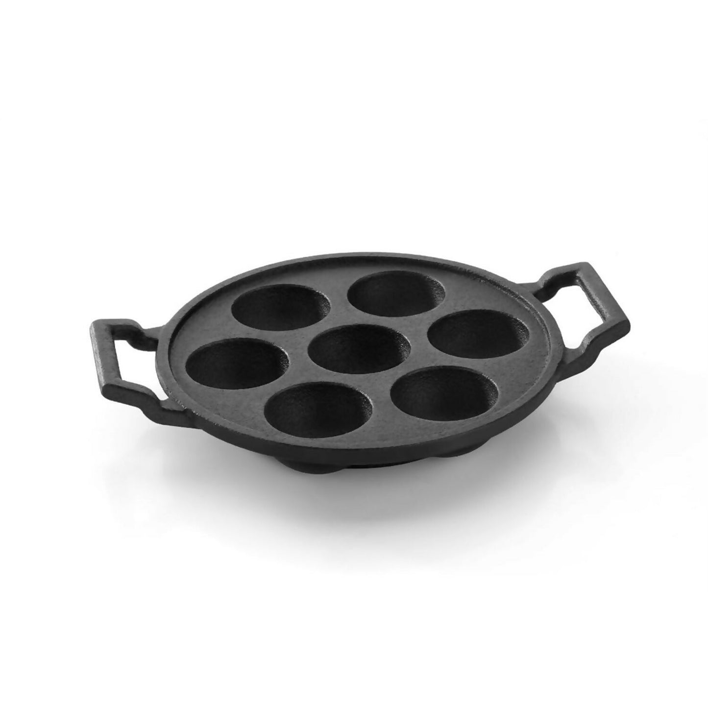 Cast iron appam pan on gas stove with snacks cooking