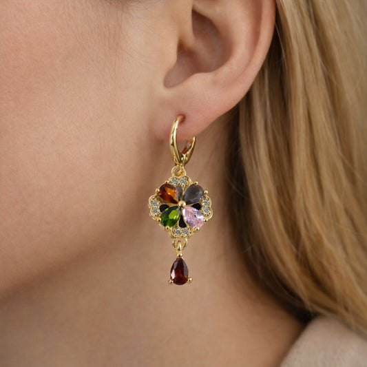 Gold-tone multicolor crystal floral hoop earrings showing front view with sparkling stones