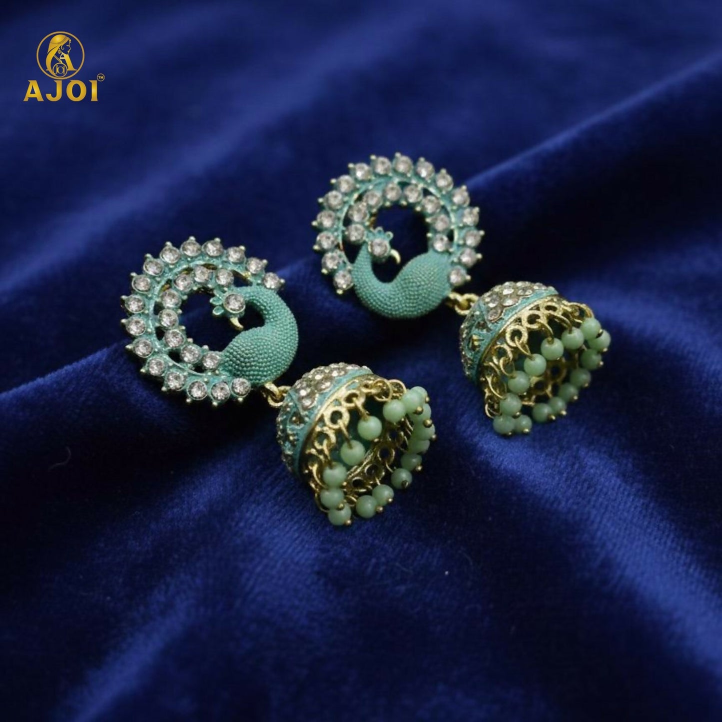 Mint green beads at the base of jhumka earrings