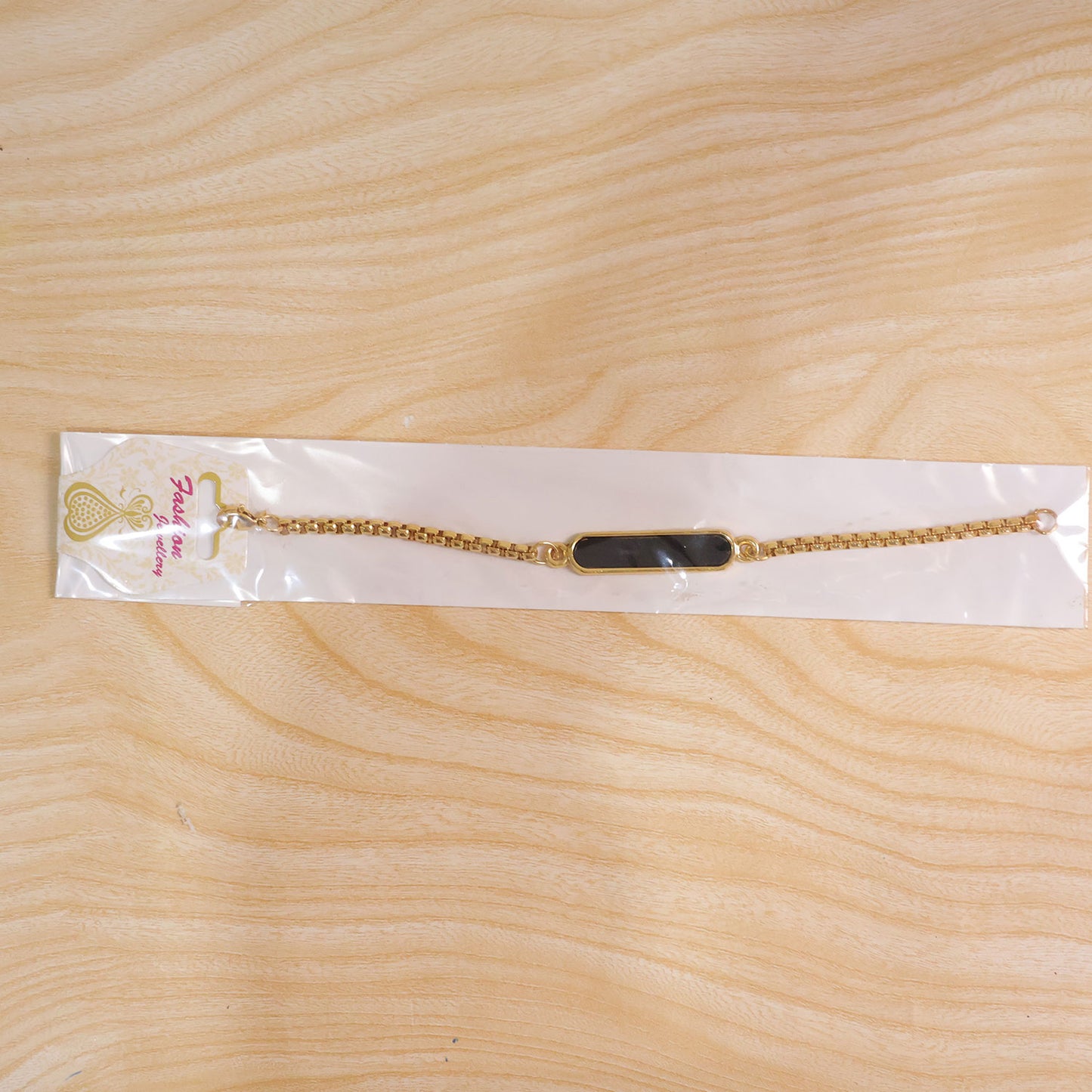 The personalized name bracelet presented in its premium gift packaging.