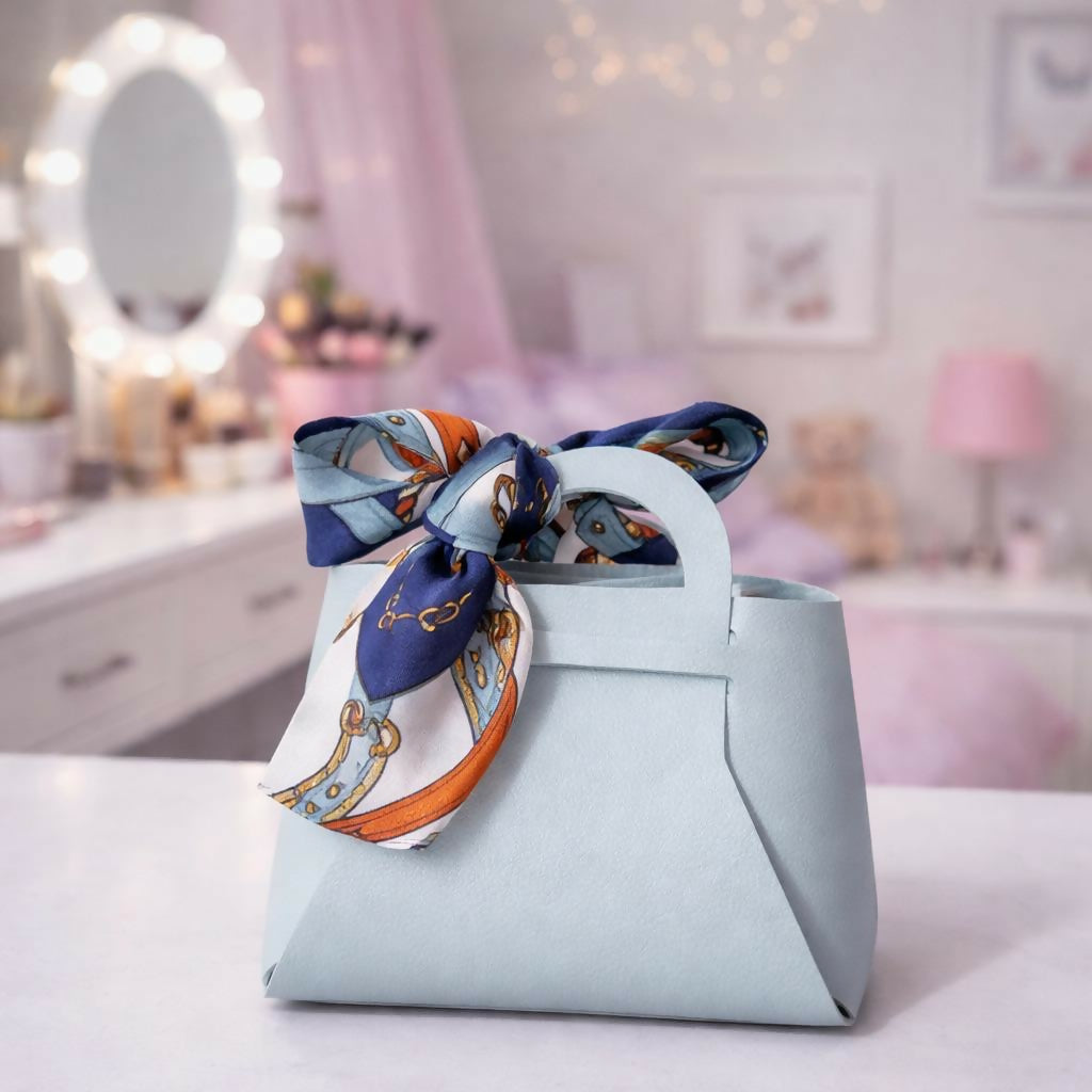 Front view of blue handbag organizer with bow detail