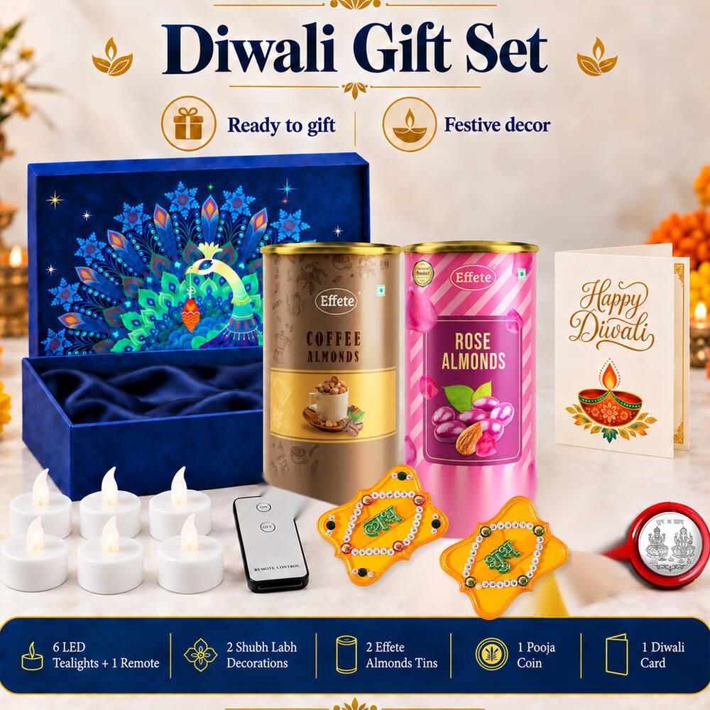 A complete Diwali gift set featuring a blue box, almond tins, a greeting card, LED tealights, and festive decor.